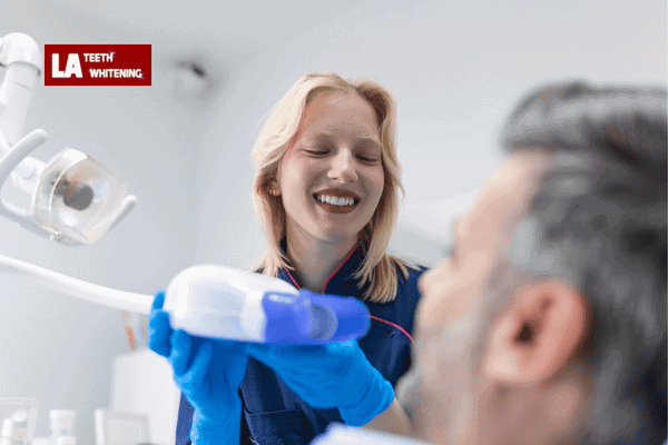 Patient receiving a professional teeth whitening treatment at the dentist's office Slough